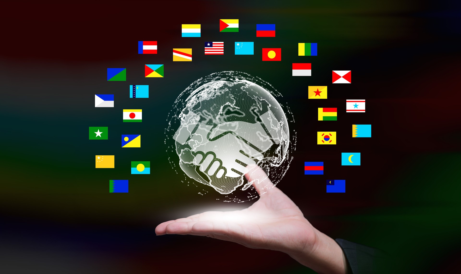 Digital globe with handshake symbol and world flags representing global partnership, international cooperation, trust, and unity in business, diplomacy, and communication.